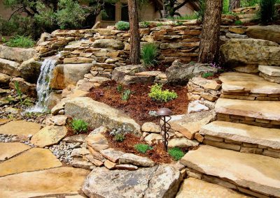 flagstone landscape design with waterfall feature